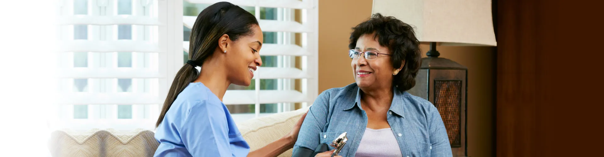 A nurse talking to a patient