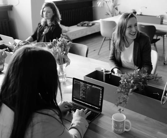 Three women at work on their laptops